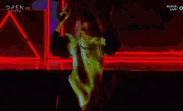 a woman 's face is projected on a screen with the words open hd beyond