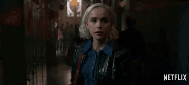 a netflix ad shows a woman in a leather jacket