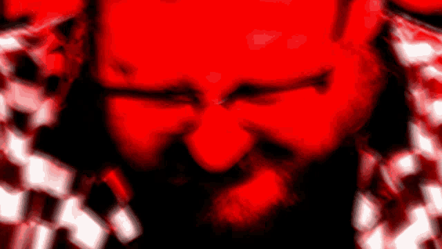 a man with a beard is making a funny face in a red background