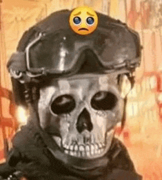 a skeleton wearing a helmet and goggles with a sad face on top of it .