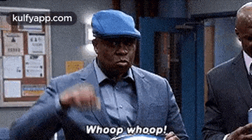 a man wearing a blue hat and a suit is holding a pot and saying `` whoop whoop '' .