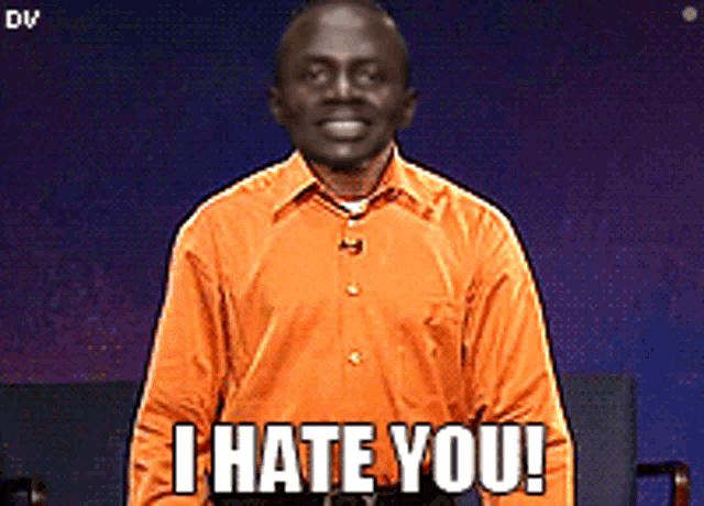a man wearing an orange shirt says i hate you