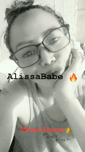 a black and white photo of a woman wearing glasses and a meme queen sticker
