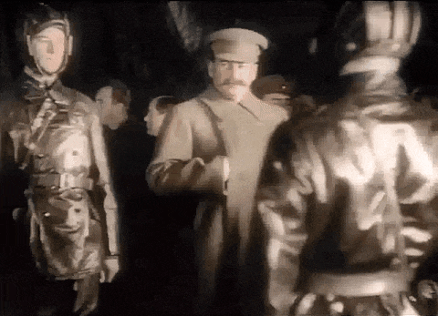 a group of men in military uniforms are standing next to each other