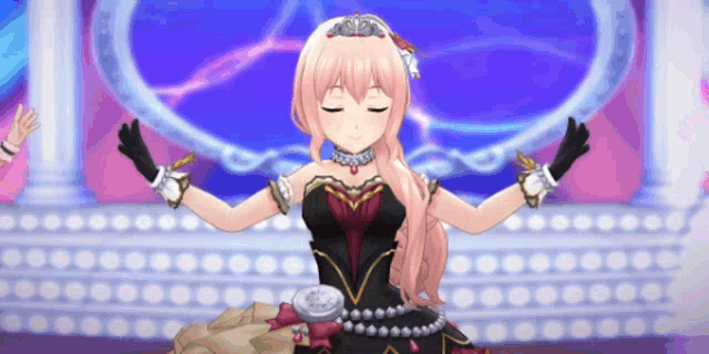 a girl with pink hair and a black dress is standing on a stage with her eyes closed .