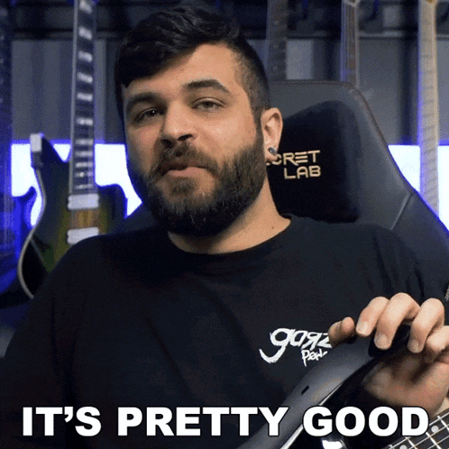a man with a beard is holding a guitar and the words it 's pretty good are written below him