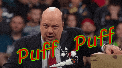 a man in a suit and tie is smoking a cigarette and says " puff puff "