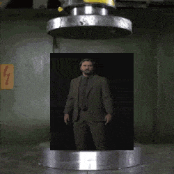 a man in a suit and tie is standing in front of a large metal object