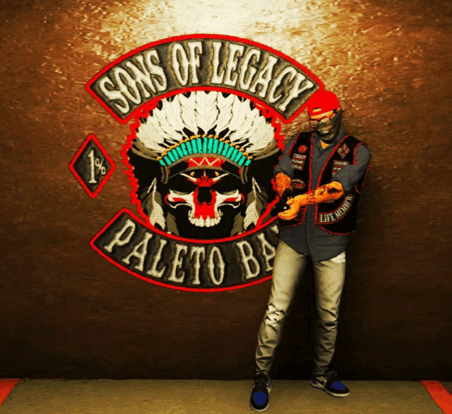 a man standing in front of a sign that says sons of legacy