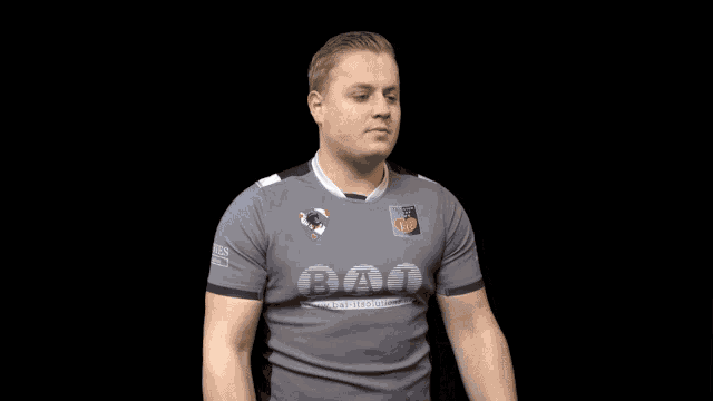 a man wearing a grey shirt that says dao