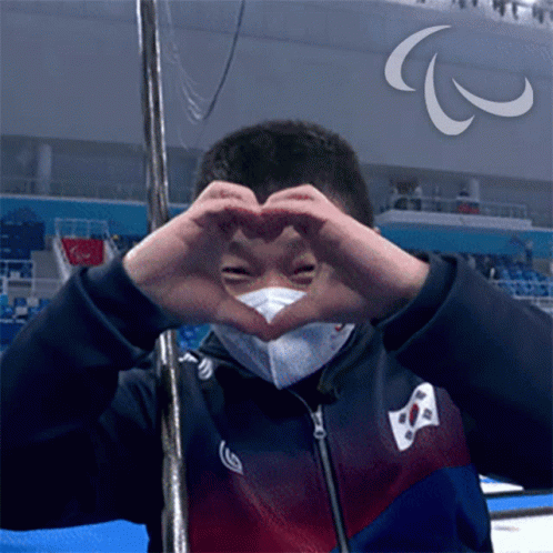Heart Sign Wheelchair Curling GIF - Heart Sign Wheelchair Curling Jaehyuk Jang GIFs