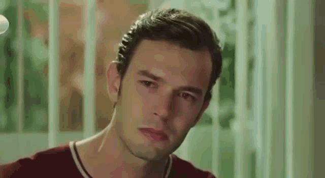 a close up of a man 's face looking at the camera .