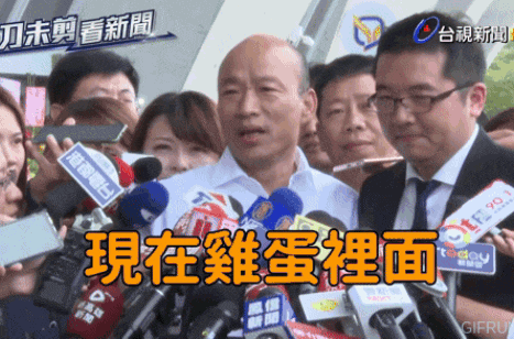 a man is surrounded by microphones with one that says tf 90.1 on the front