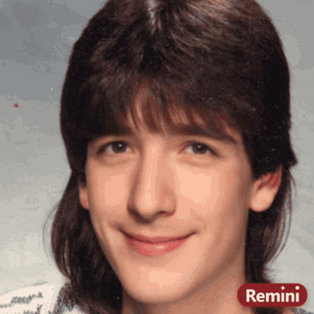 a close up of a man 's face with remini written on it