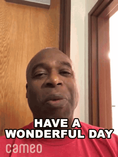 a man in a red shirt is saying have a wonderful day