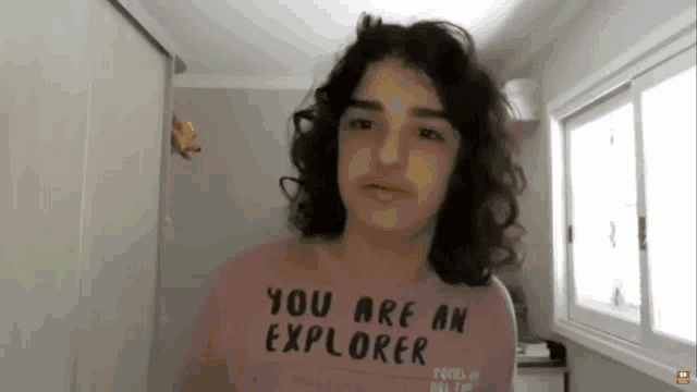 a shirt that says you are an explorer is on a person 's chest
