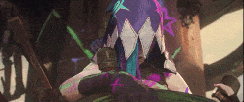 a cartoon character with purple and green hair is sitting on a chair .