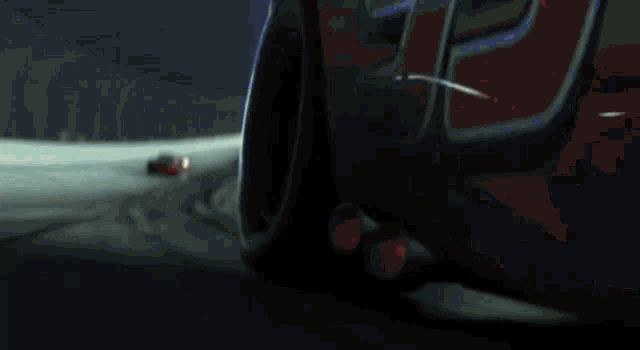 a red rusteze race car is driving down a race track