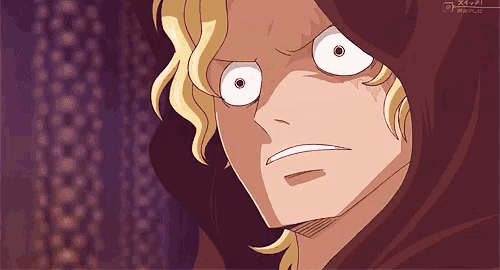 a close up of a cartoon character with a hood on his head making a funny face .
