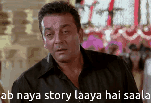 a man in a black shirt with the words ab naya story laaya hai saala written below him