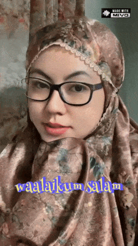 a woman wearing glasses and a hijab with the words waalaikum salam written on the bottom