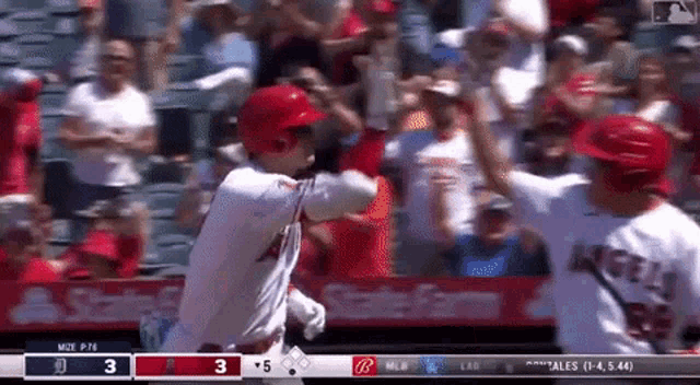 a baseball game is being played in front of a state farm sign
