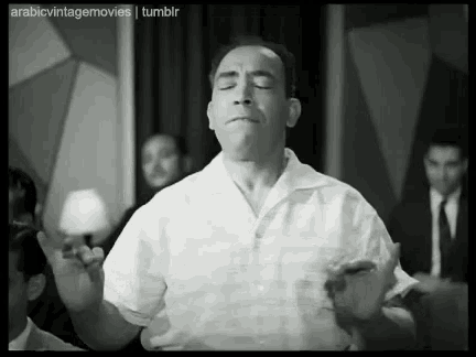 a black and white photo of a man with arabic vintage movies tumblr written at the top