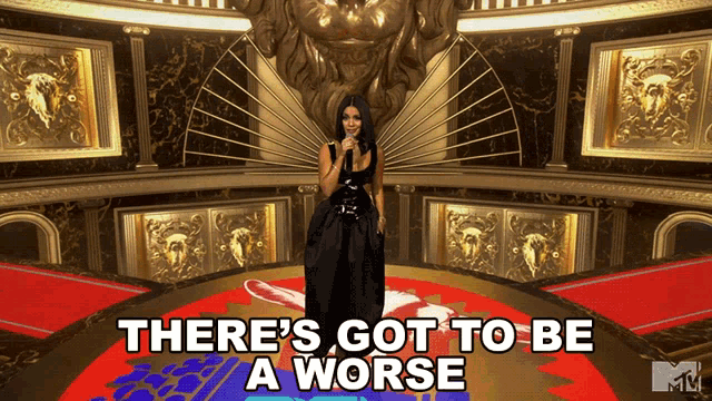 a woman in a black dress stands on a red carpet with the words there 's got to be a worse