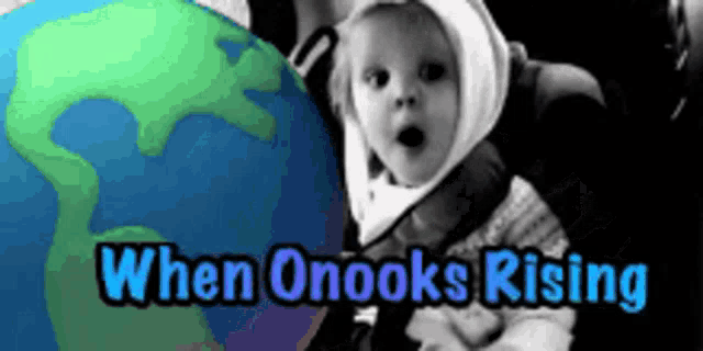a baby is standing in front of a globe with the words when onooks rising