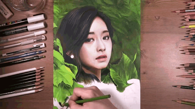 a drawing of a woman with a green pencil on a table