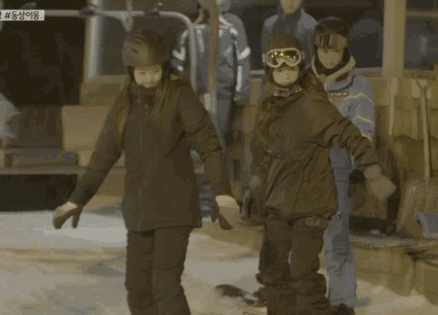 a person wearing a helmet and goggles standing in the snow