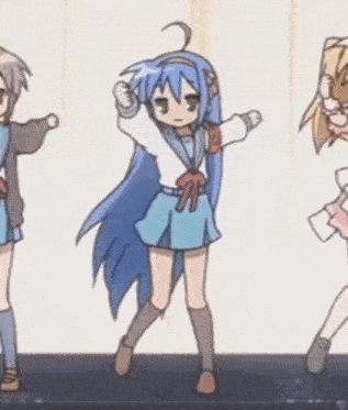 a girl with blue hair is dancing next to a girl with blonde hair
