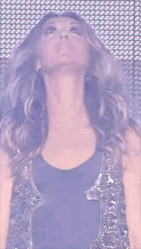 a close up of a woman 's face looking up at the sky