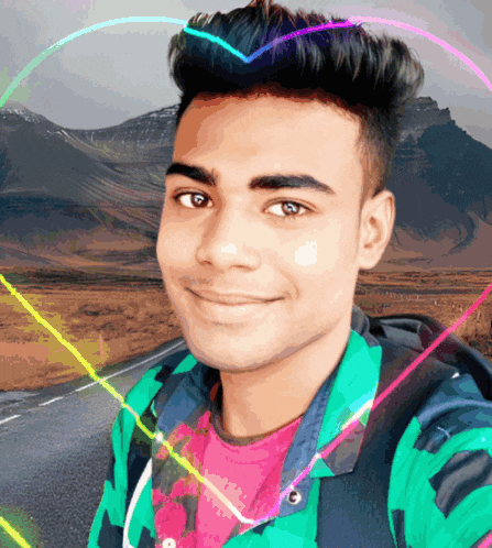 a young man in a green jacket is smiling with a heart in the background