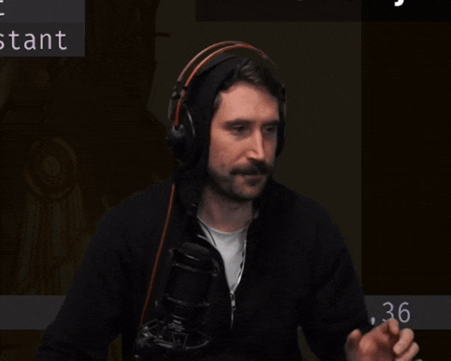 a blurry picture of a man with a beard and headphones with the number 1.36 on the bottom
