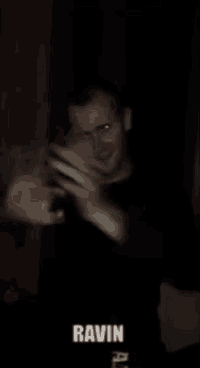 a blurry picture of a man with the name ravin written on the bottom