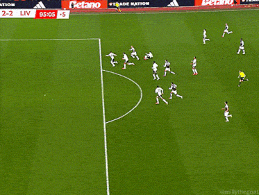 a soccer game is being played and the score is 2-2
