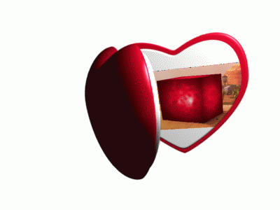 a heart shaped mirror with a desert scene on it