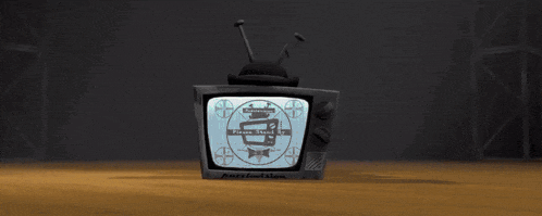 a cartoon character with a television head is standing in front of a red curtain holding a wand .