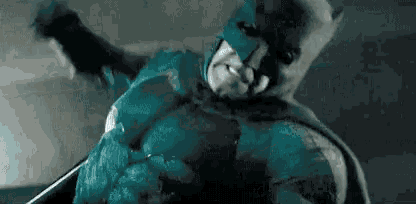 a close up of a man in a batman suit