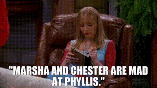a woman is sitting in a chair reading a book with the words " marsha and chester are mad at phyllis "