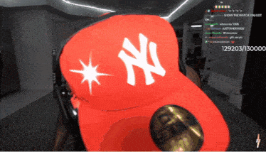 a new york yankees hat is being worn by someone