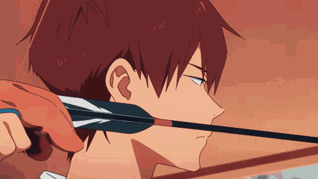 a man with red hair is holding a bow and arrow in his mouth