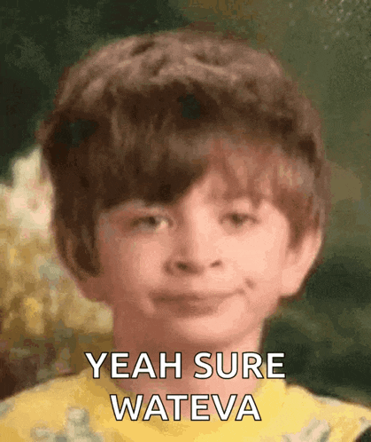 a young boy in a yellow shirt is smiling and says " yeah sure wateva "