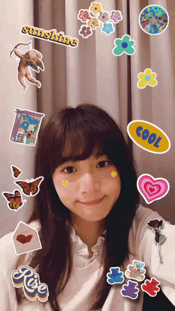 a girl is surrounded by stickers including one that says sunshine