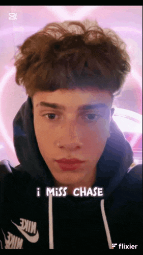 a young man is wearing a nike hoodie and has the words i miss chase on his face