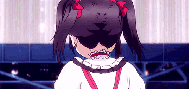 a girl with pigtails and a bow on her head