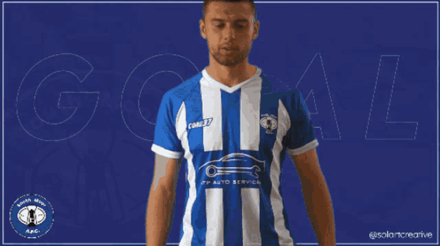 a man in a blue and white striped shirt with the word goal on the bottom