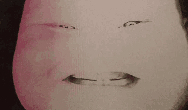 a close up of a person 's face with a pink background and a black background .