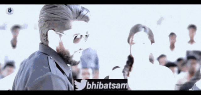 a man wearing sunglasses stands in front of a crowd with the twitter hashtag bhibatsam
